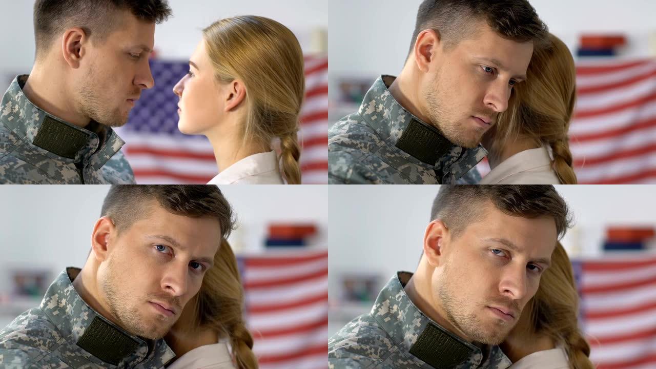 悲伤的军人丈夫拥抱着女友，看着镜头的特写，永别了