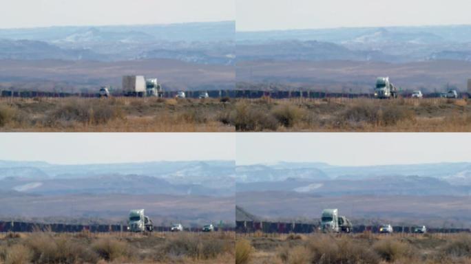 在阳光明媚的日子里，半卡车和其他车辆在犹他州州际公路上行驶的半雾霾扭曲视频的平移镜头被群山环绕