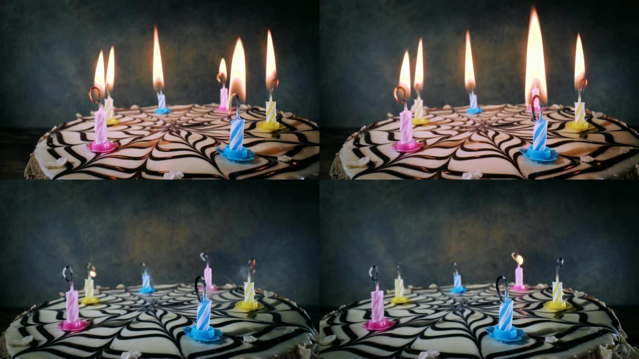 在生日蛋糕上吹灭蜡烛