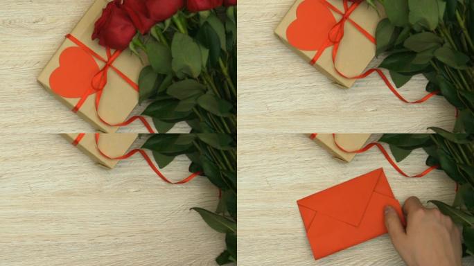 礼盒，玫瑰花束和红包躺在桌子上，情人节