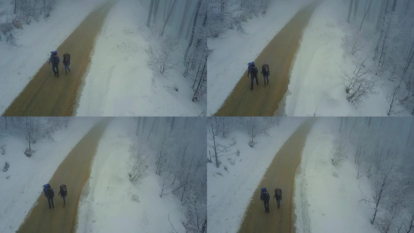 情侣在冬季自然户外徒步旅行，鸟瞰图