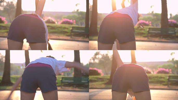 在公园里伸展运动的亚洲女性