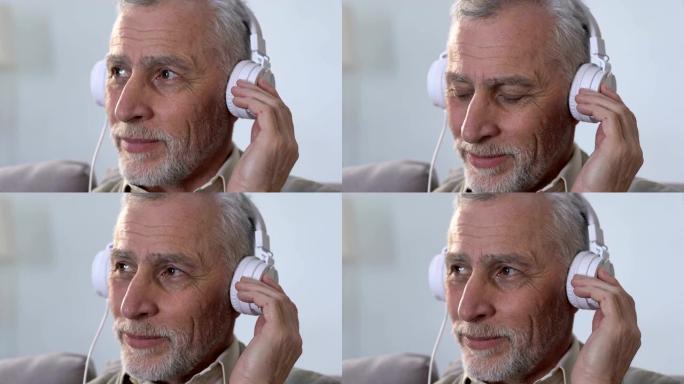 戴耳机的老年男性听音乐，有节奏，现代风格