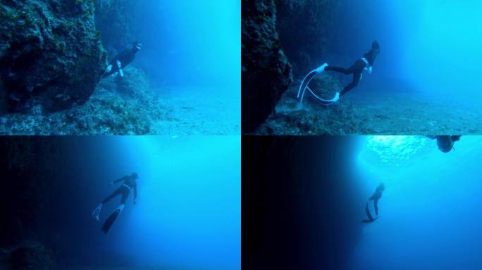 潜水潜水员从洞穴中游泳的水下慢动作镜头