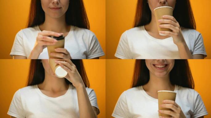 女孩从塑料杯上取下盖子，正确喝热咖啡的提示，特写镜头