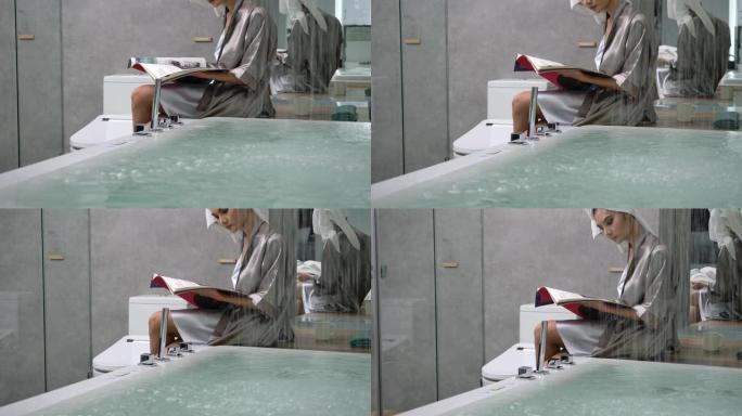 4k慢动作身材性感女人穿丝绸睡衣坐在浴缸附近阅读