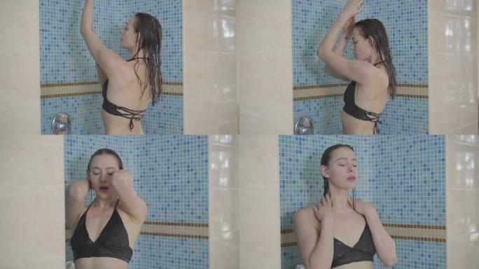 漂亮的黑发女人在游泳池后洗澡。穿着黑色比基尼的性感高加索女士的肖像。休闲、生活方式、放松、感官享受。