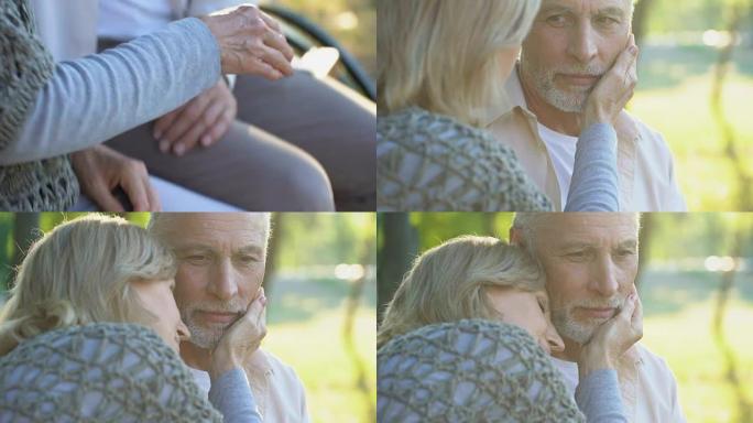 50多岁的有爱心的女人温柔地抚摸着丈夫的脸，关系和爱