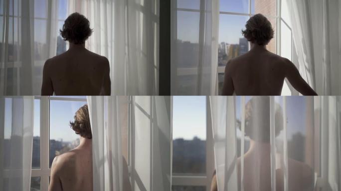 赤裸的年轻人来到窗前，打开白色薄纱，从高层建筑看到惊人的城市景观。