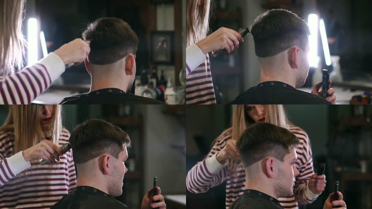 电动剃须刀男性理发。头发修剪器发型的特写。专业理发师用理发推子理发。电动剃须刀男士美发