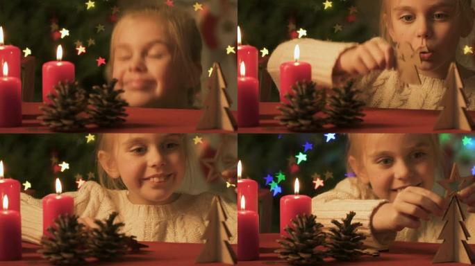 女孩玩松果和木制圣诞玩具，节日气氛