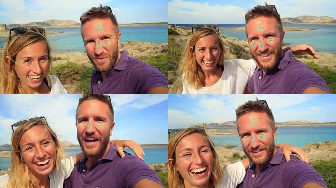 年轻夫妇在海边度假时自拍