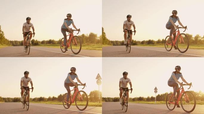 一名男子和一名女子在日落时在高速公路上骑运动自行车，装备和防护头盔慢动作120 fps