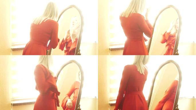 带镜子的红色连衣裙女人