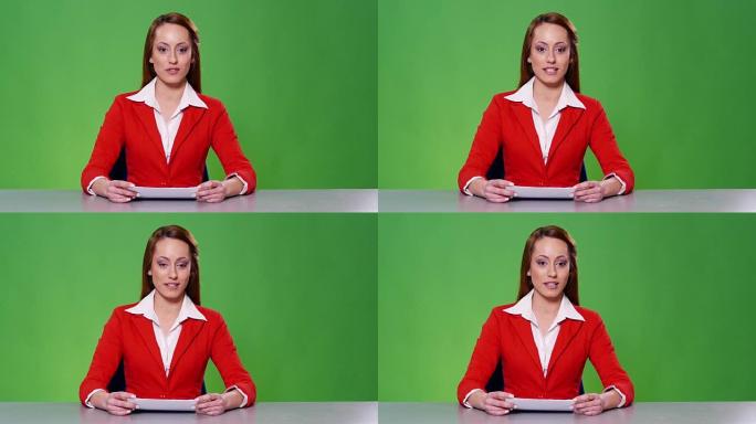 绿色背景红色西装的4k女新闻播音员