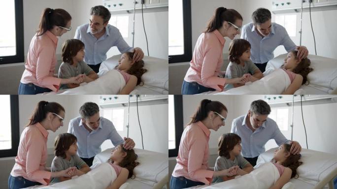 充满爱心的家人探望躺在病床上的小女孩，非常高兴地与她交谈