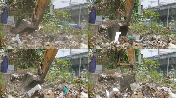 挖掘机在施工现场收集建筑垃圾