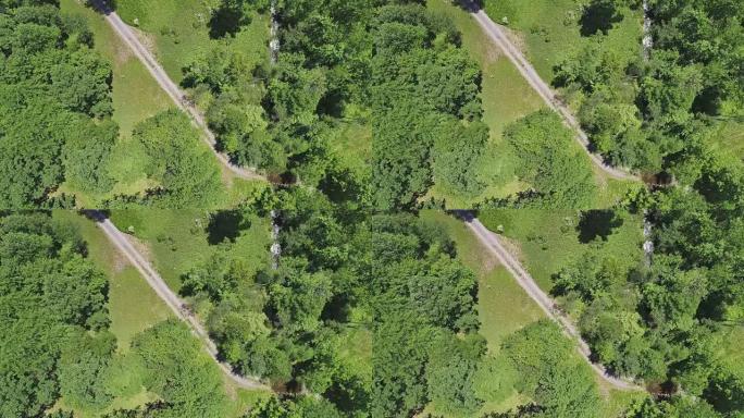 缓慢下降。在夏季晴天，空中无人机可以直接看到乡间小路和波科诺山脉森林中的小河。