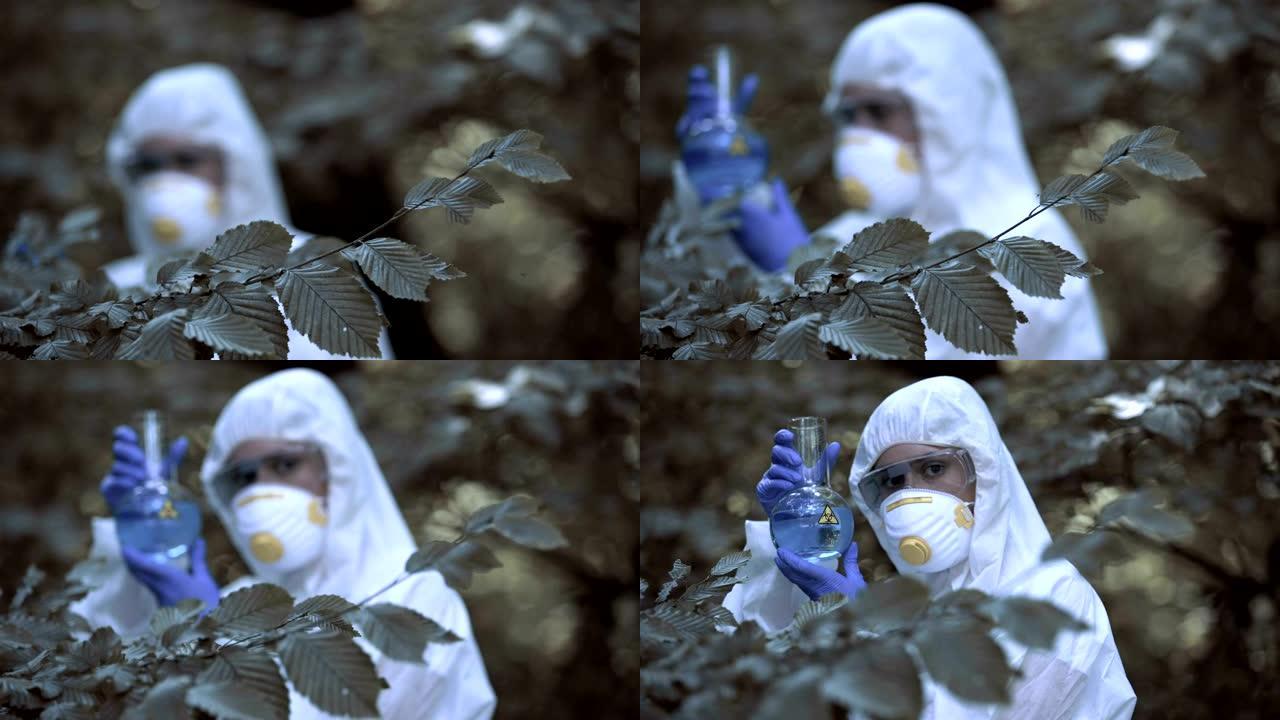 实验室工作人员拿着生物危害试管，危险病毒，全球威胁污染