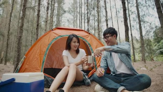 亚洲年轻夫妇喜欢在松树林露营