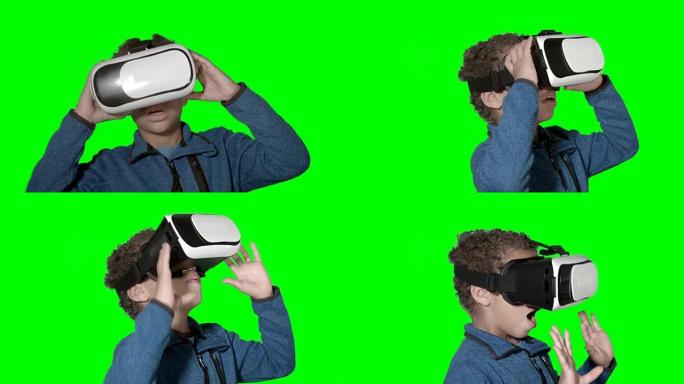 高清: 使用虚拟现实模拟器的小男孩