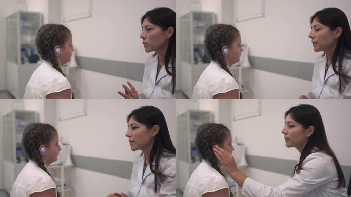 护士检查女孩的耳朵