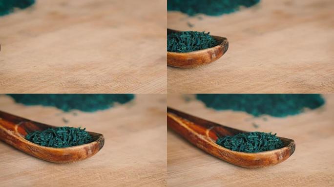 木板和勺子上的螺旋藻片