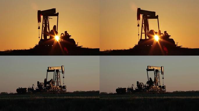 石油井架在德克萨斯州北部日出时抽出原油
