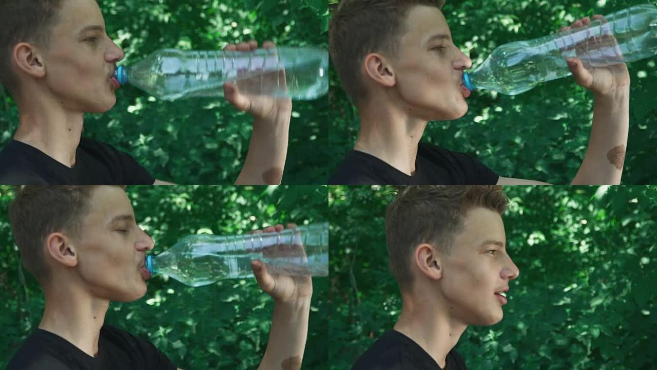 金发男孩正在喝水
