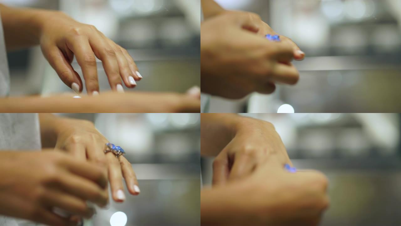 一个女人在珠宝店试戴戒指的特写镜头