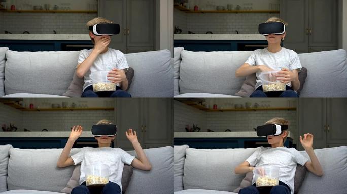 男孩戴着vr眼镜看电影，吃爆米花
