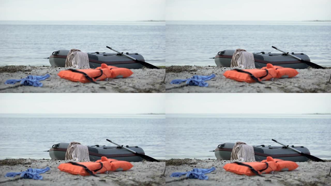 海滩上的弃船，救生衣和衣服，游泳伤害统计