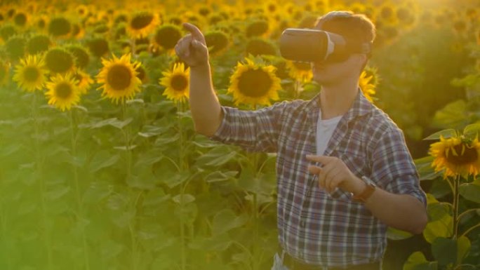 这位年轻的农民戴着VR眼镜工作