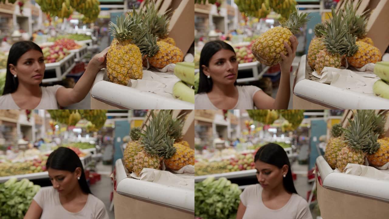 农贸市场上漂亮的女顾客从看台上抢菠萝