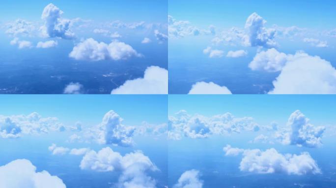空中拍摄漂浮在风景上方的蓝天中的积云