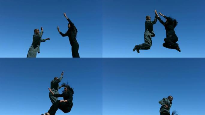 商人在空中跳跃，做高五，慢动作