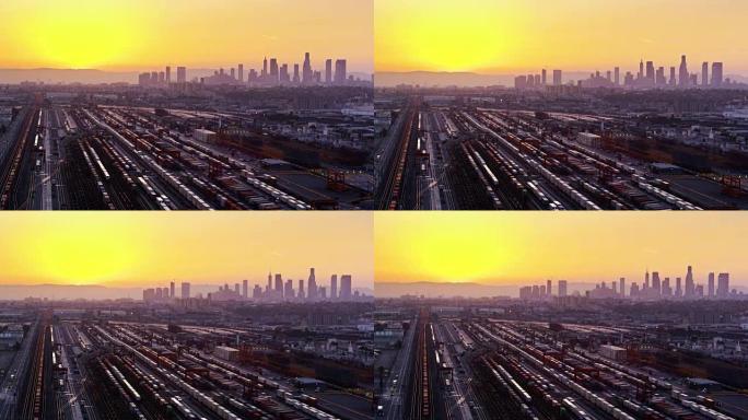 弗农多式联运码头上发光的黄色日落，洛杉矶天际线-无人机拍摄