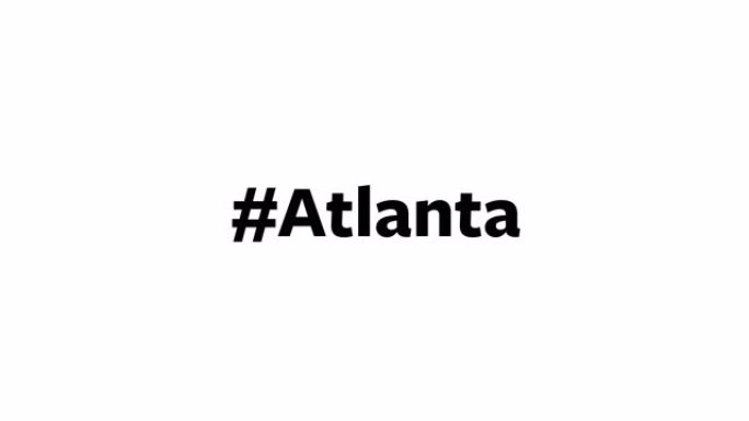 一个人在电脑屏幕上输入“#Atlanta”