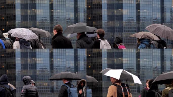 雨中带伞的城市通勤者。