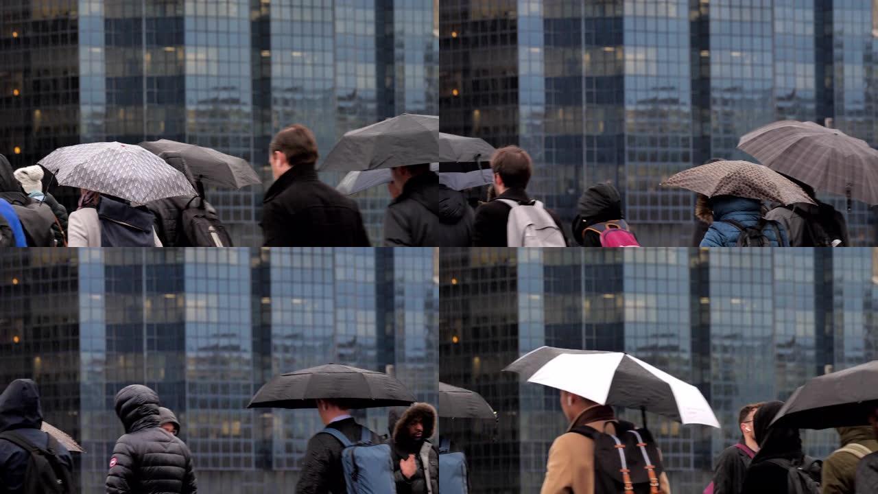 雨中带伞的城市通勤者。