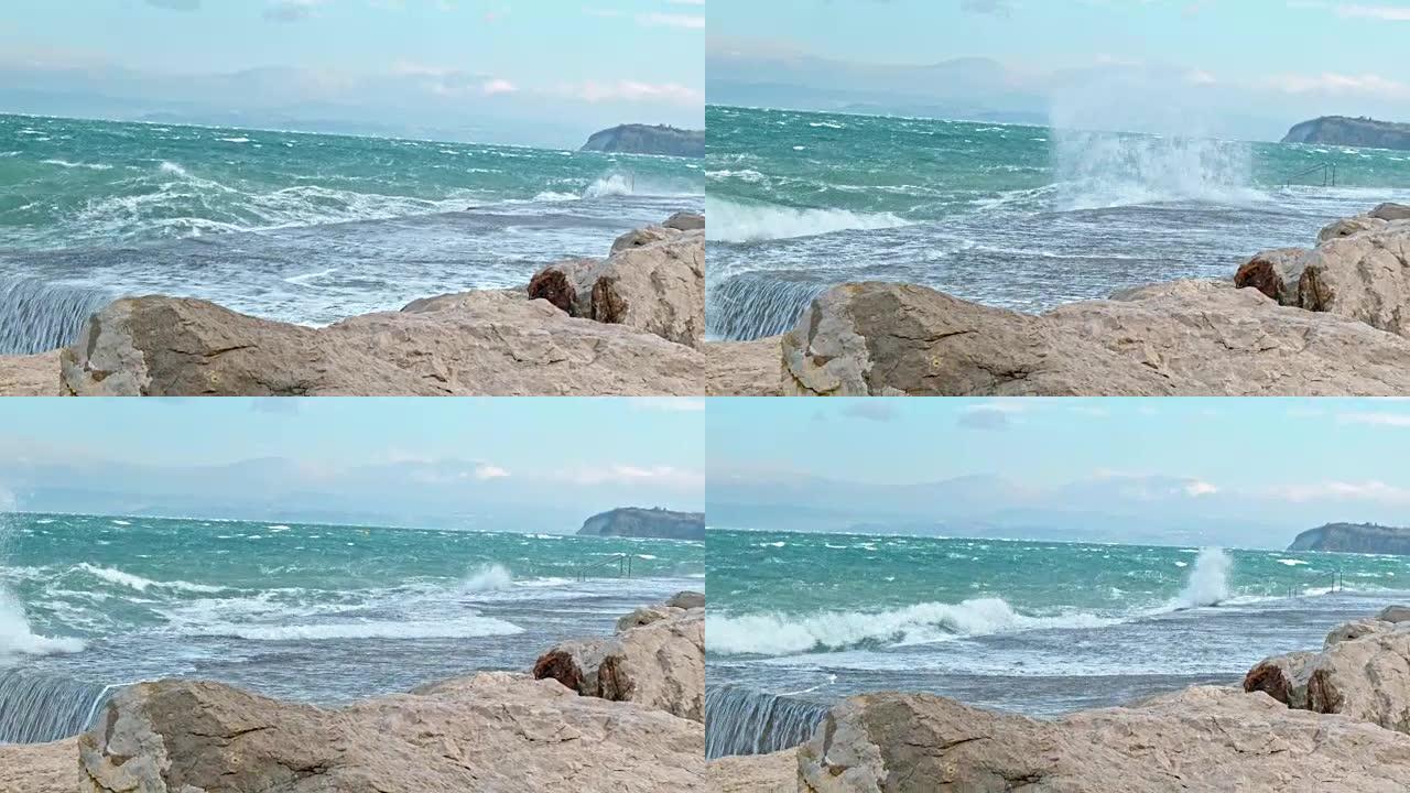 强风在岩石海滩上引起波浪