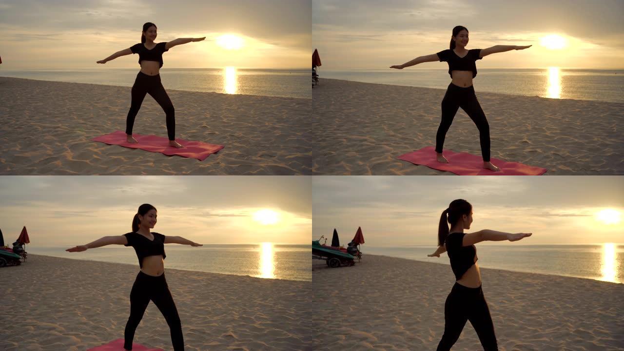 美女早上在沙滩上玩瑜伽