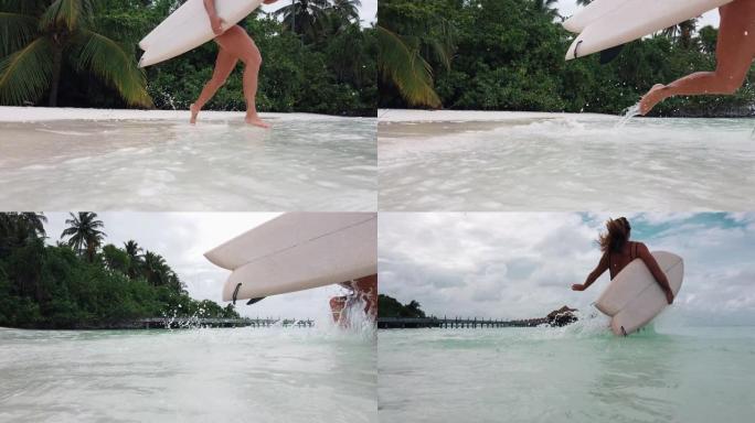 女人用冲浪板奔向海洋