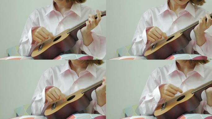 玩夏威夷四弦琴的女士。前视图。从右到左。