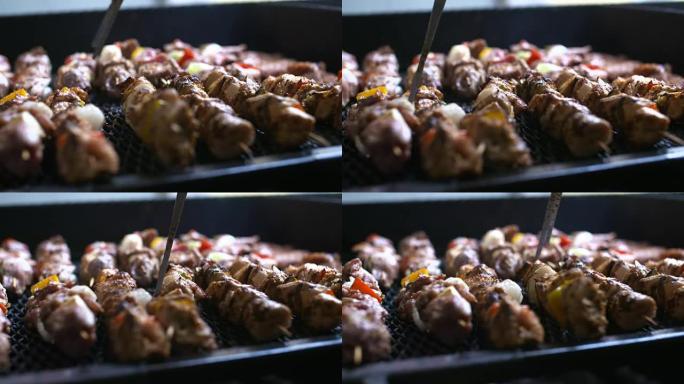 烧烤和美味的烤肉放在烤架上。烧烤派对。