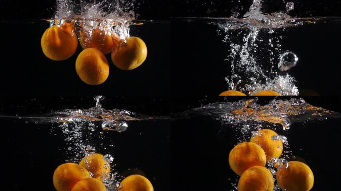 超级慢动作: 橙色落入黑色背景的淡水中