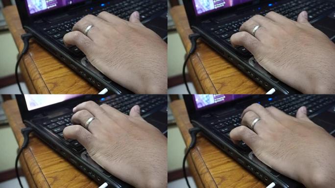 键盘上的打字特写工作上班办公敲键盘打字笔