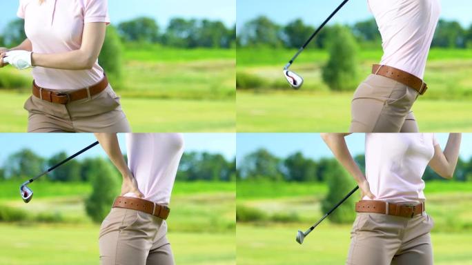 女子高尔夫球手向后挥杆击球，感觉下背部剧烈疼痛