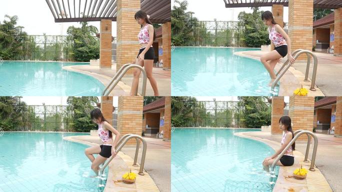 女人在游泳池里放松和享受