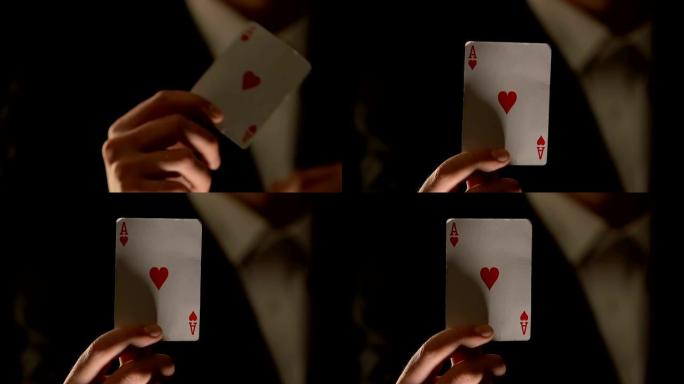 男性向镜头展示红心a，幸运符，扑克游戏获胜